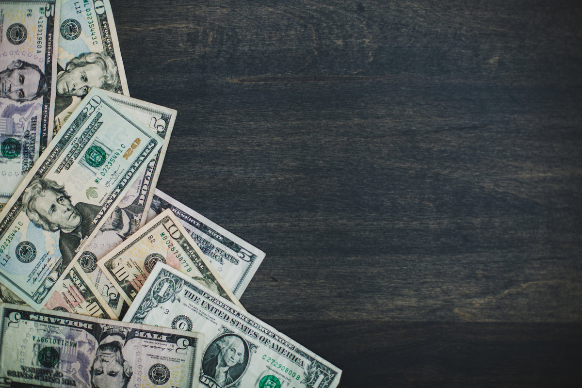 a pile of money on a table